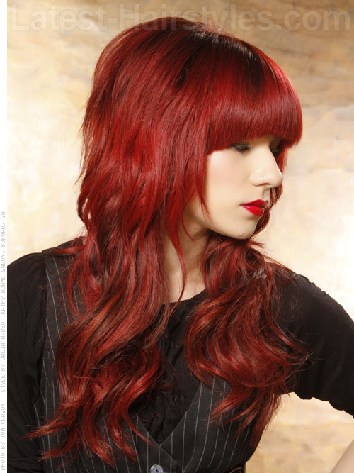 red wavy hairstyle with bangs