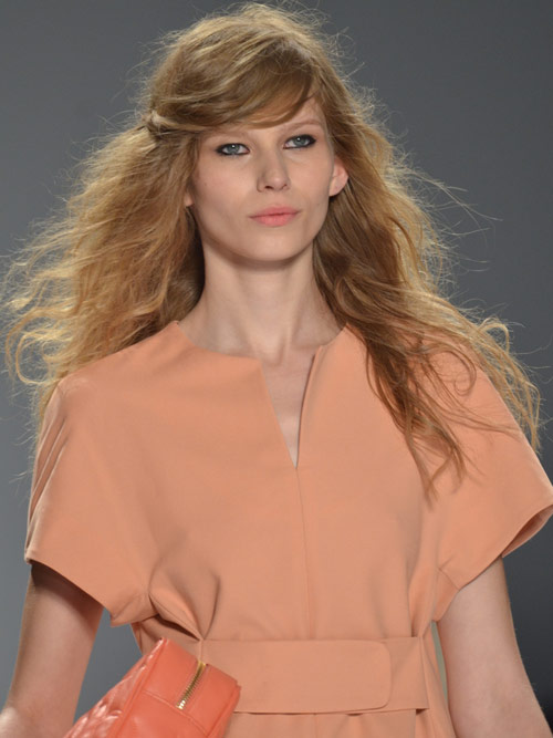 Messy runway style with side swept bangs