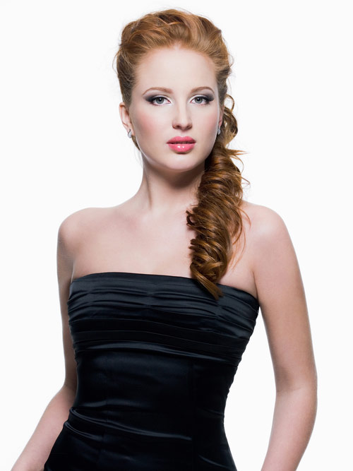 A romantic long curled ponytail with strapless dress
