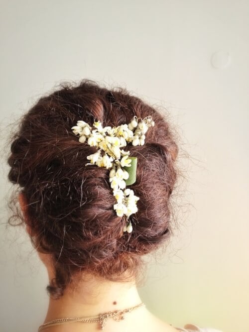 french hairstyle twist with flowers