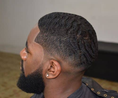 Perfectly cleaned up low taper fade with 360 waves