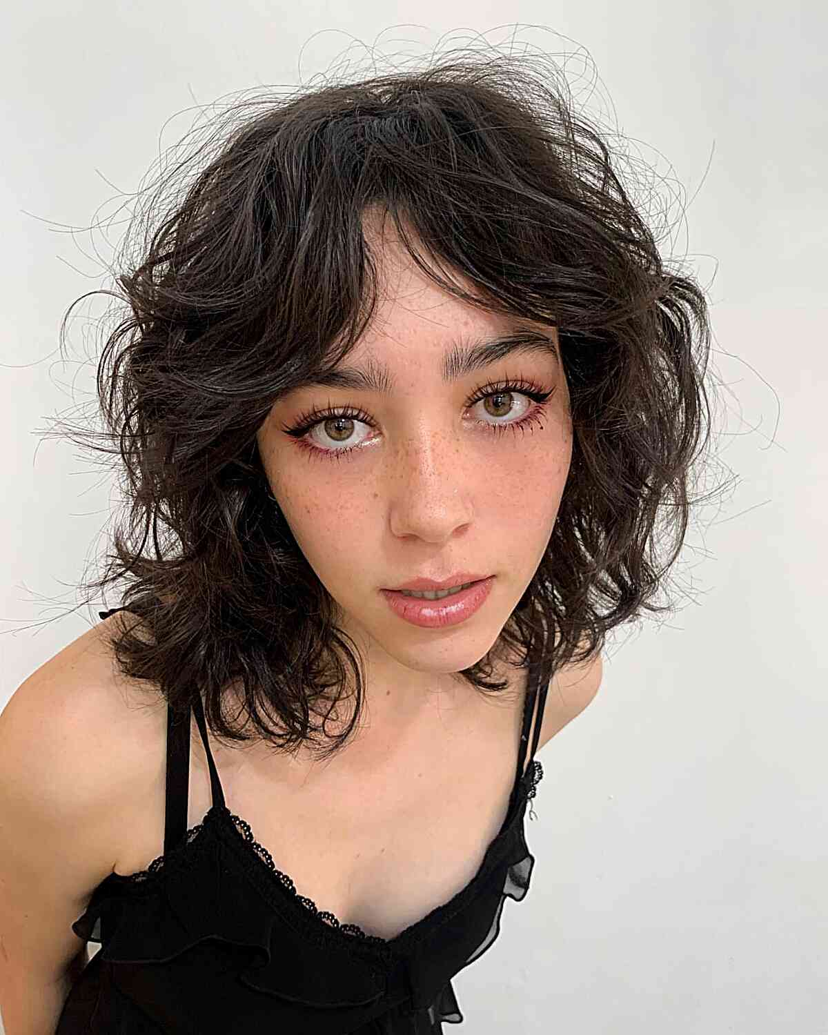 Medium Short Tousled Wolf Cut with Middle Part Bangs