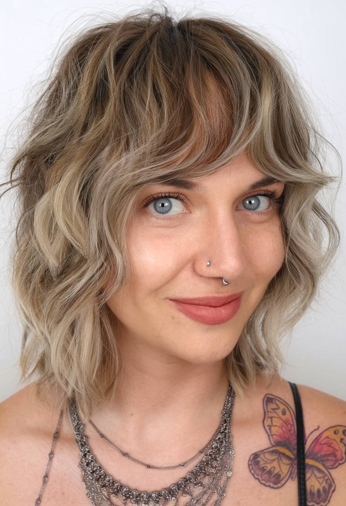 70s-inspired shag haircut for short wavy hair with choppy layers