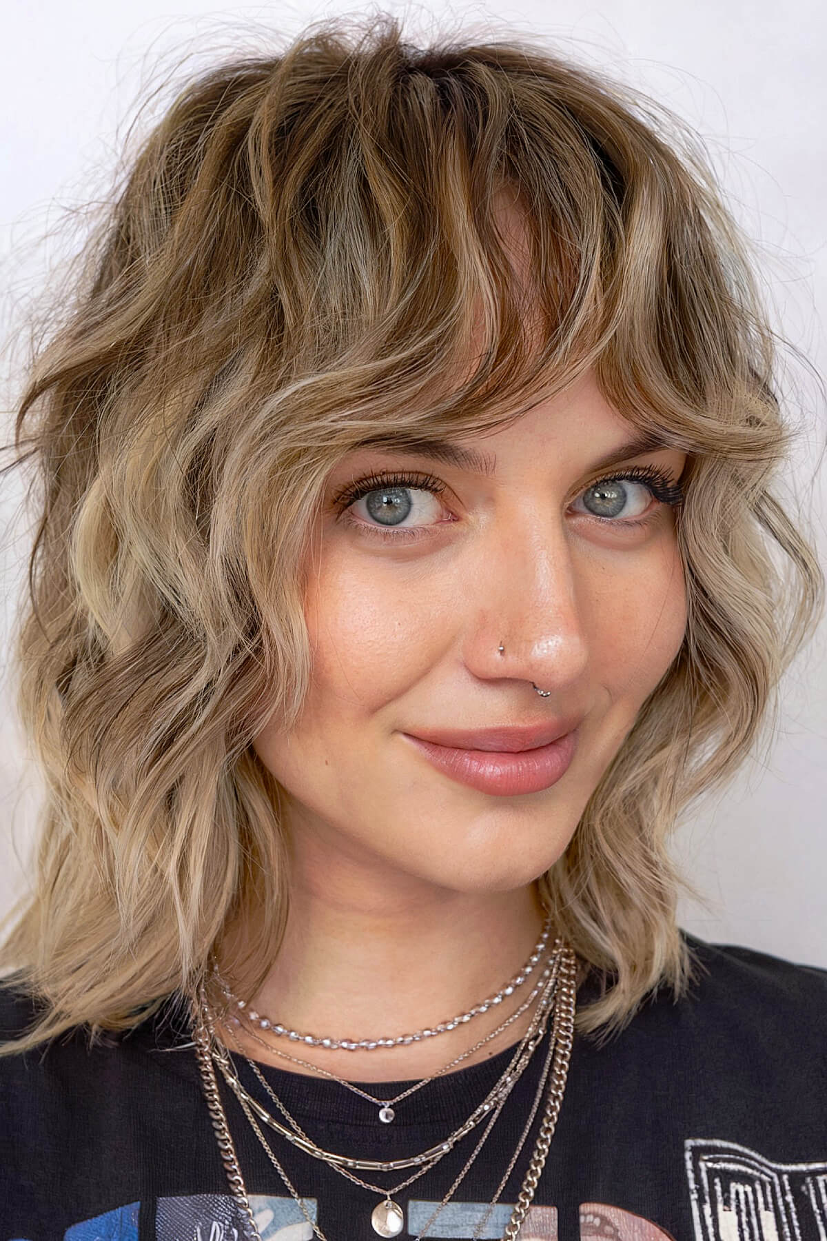 70s-inspired shag haircut for short wavy hair with choppy layers