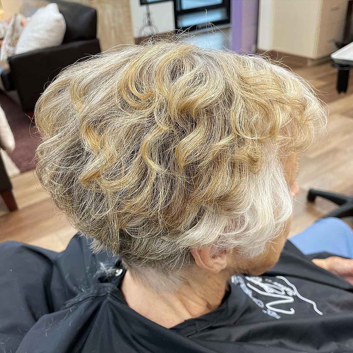 A flattering wedge haircut for women over 60 with curly hair
