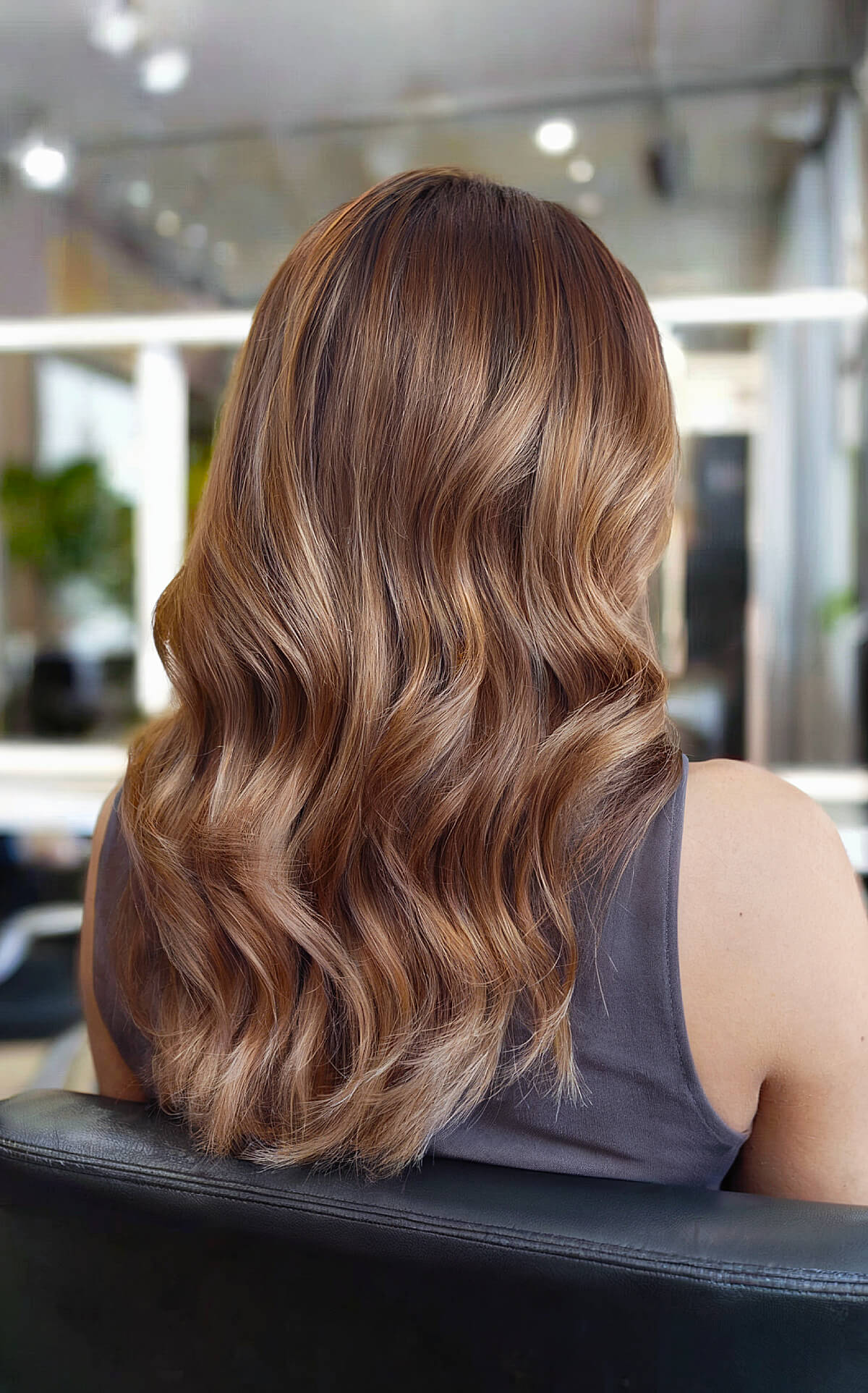 Cool-toned light brown hair with loose waves for a soft, natural look