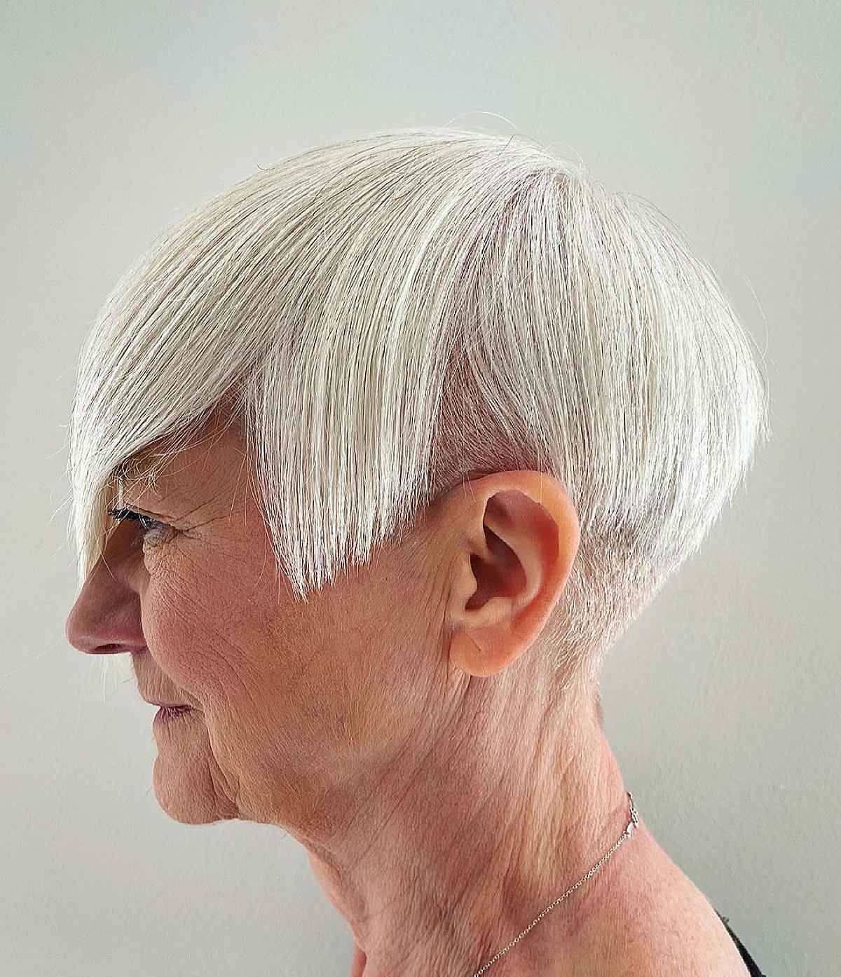 A wedged hairstyle with an undercut on a sixty-year-old woman