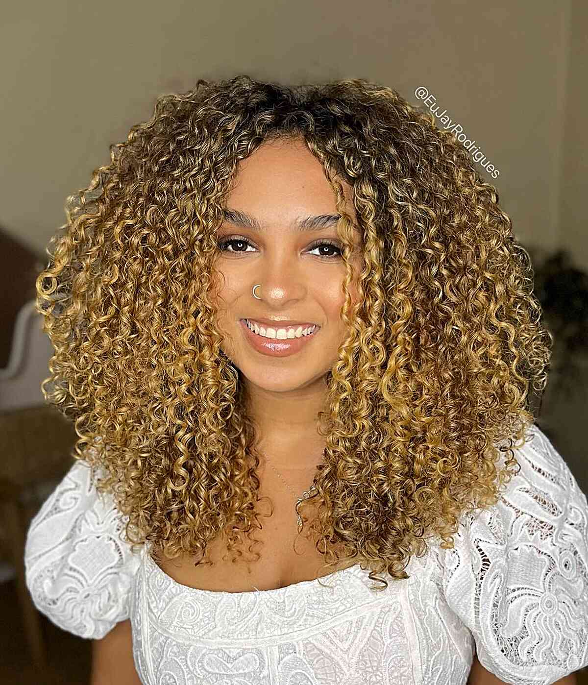 Golden Blonde Face-Framing Curls with Middle Part