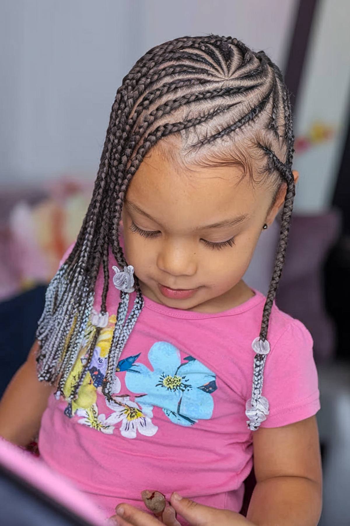 Cornrow braided hairstyle with beads for toddler girls