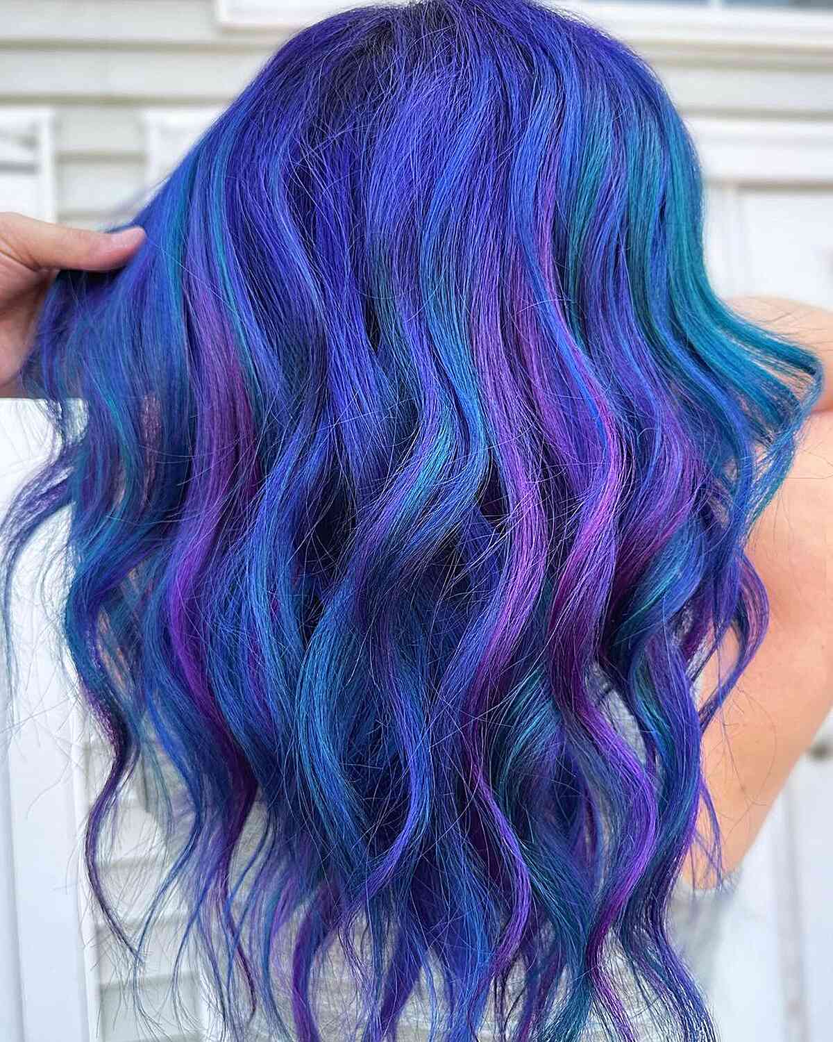 Alluring Blue and Purple Tones for long wavy hair