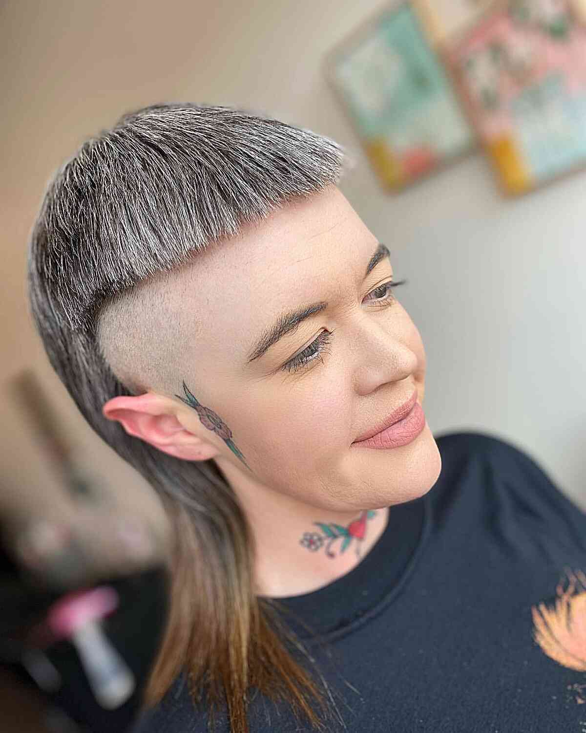 Alternative Mid-Length Buzzed Mullet with Super Short Bangs