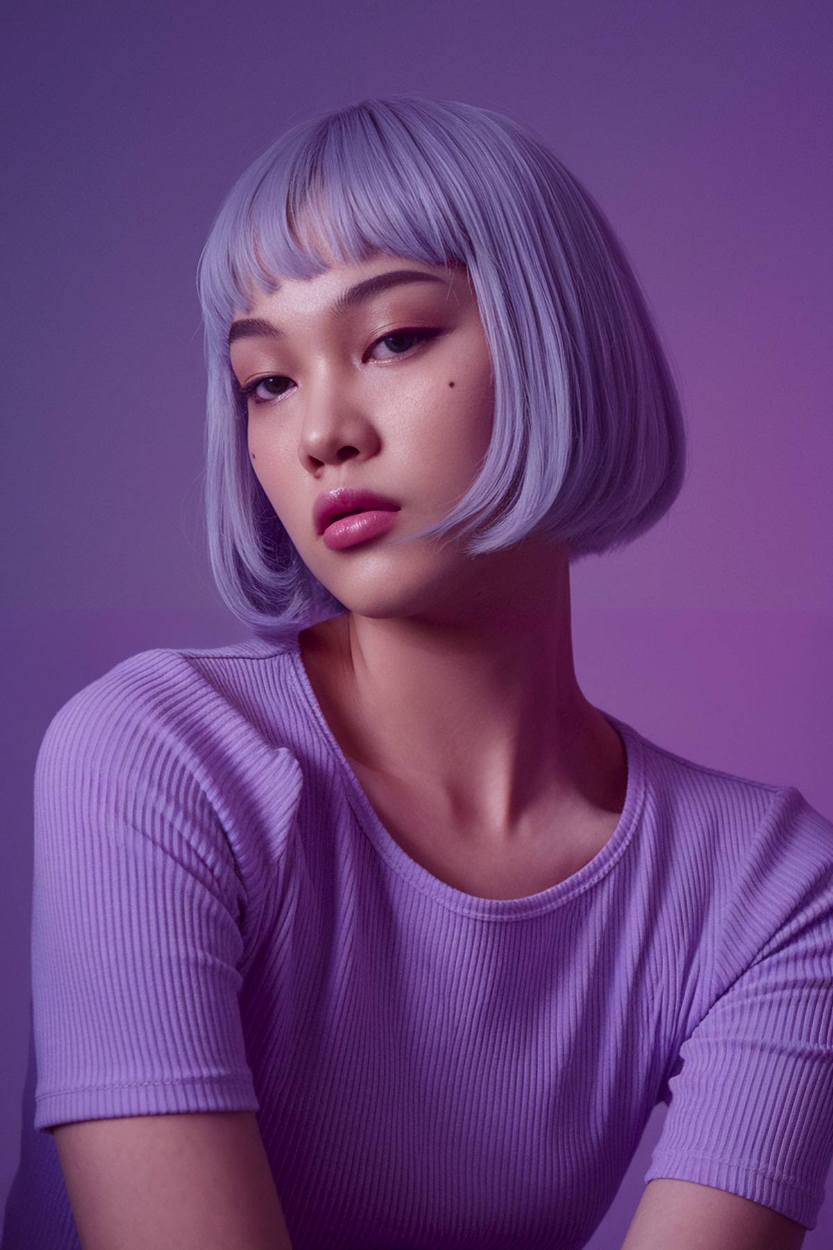 Chin-length amethyst edge bob with sharp precision and a deep purple to lavender gradient