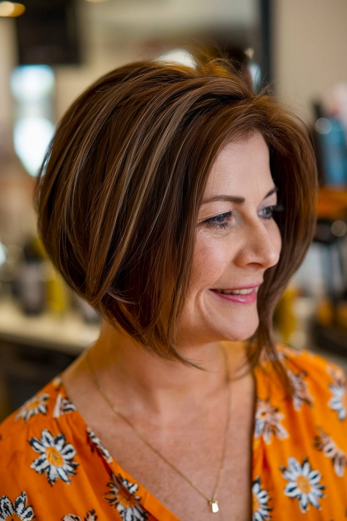 A precision-cut angled bob designed to add fullness and shape to fine hair, featuring soft layering for extra body