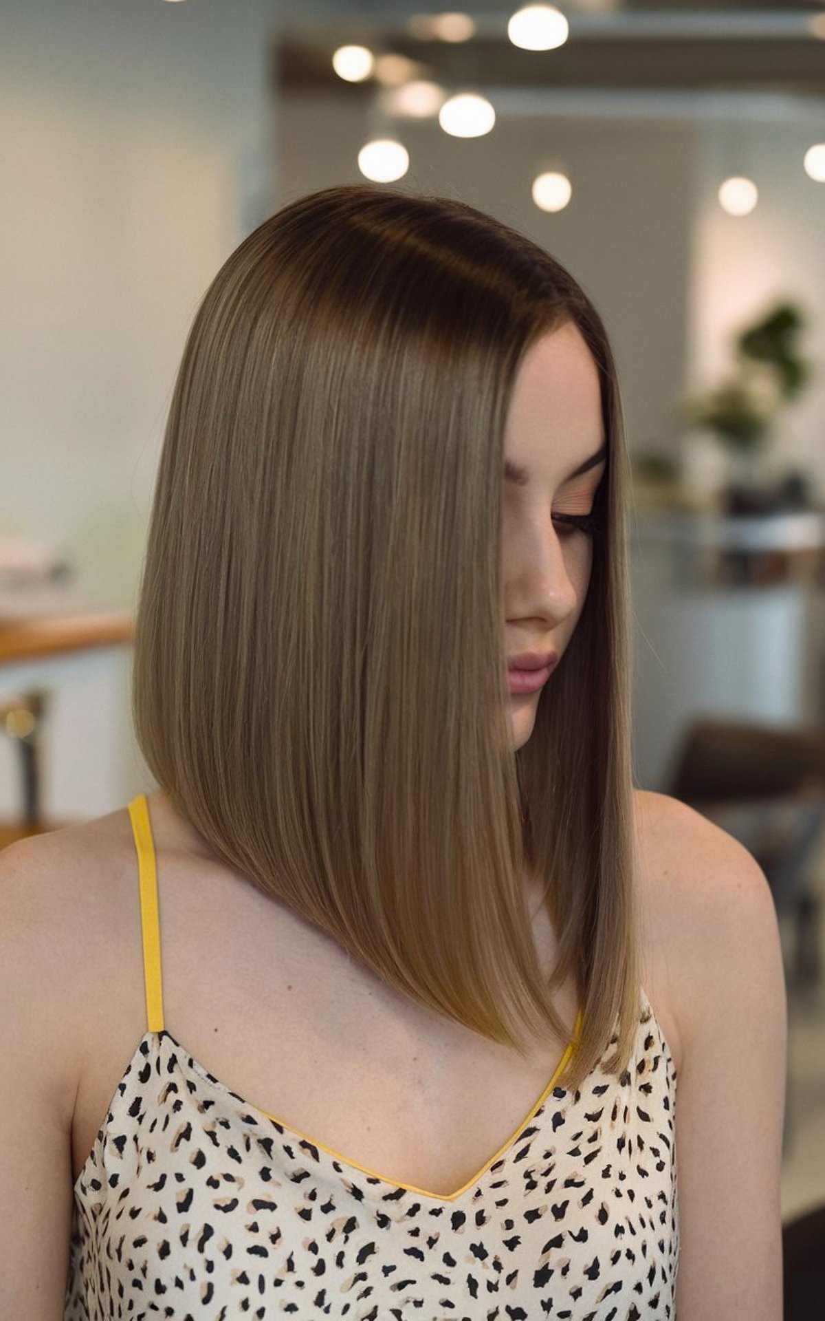 Angled bob with sleek, straight hair for medium length