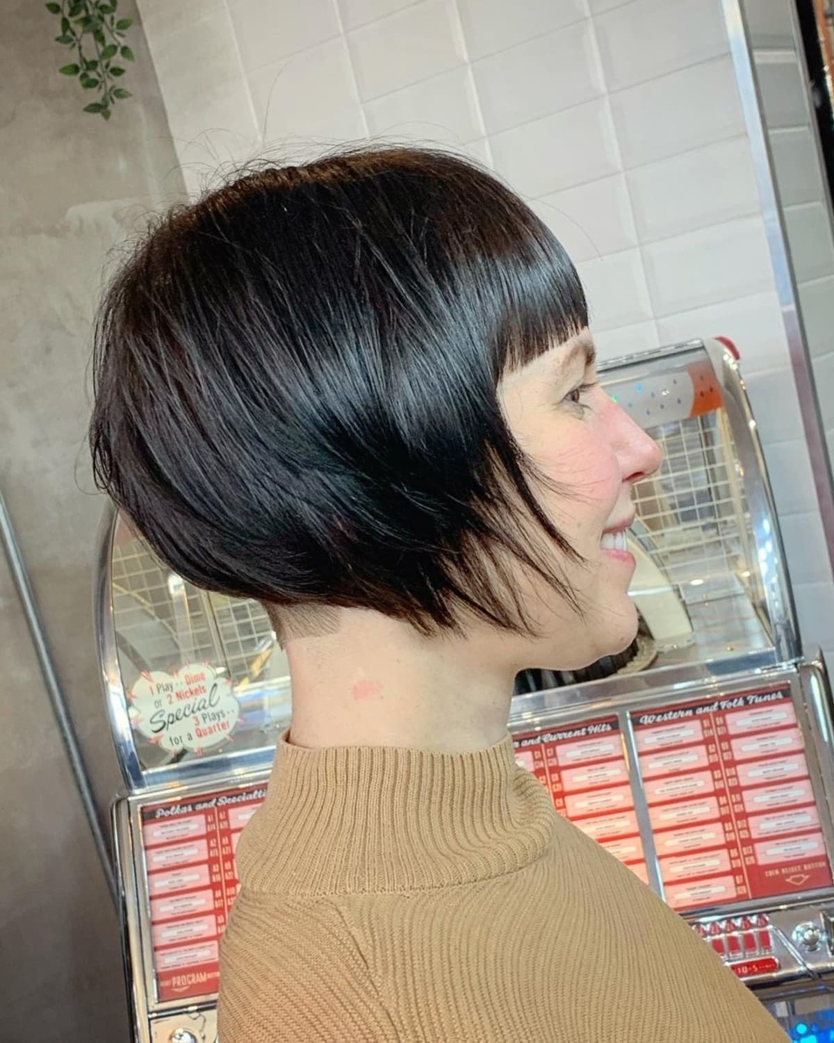 Angled bob with an undercut and bangs