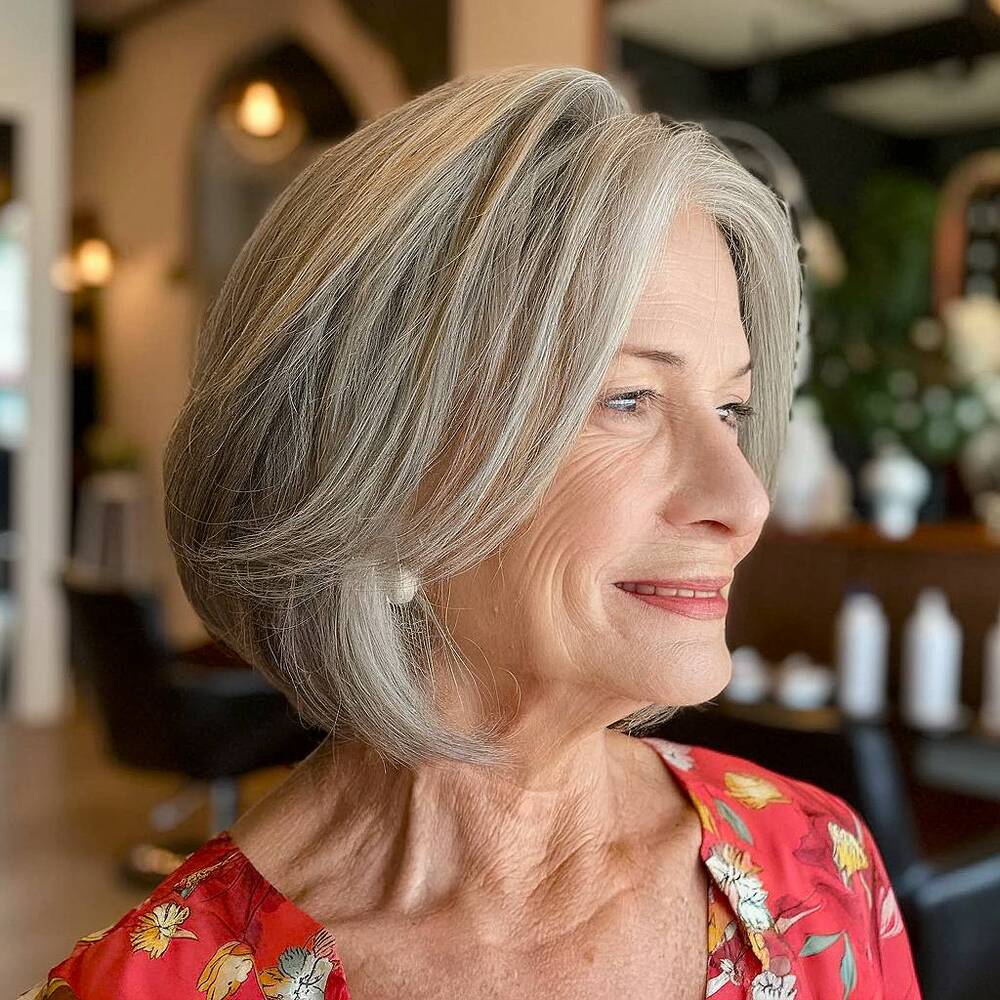 Modern angled bob with face-framing layers, adding softness and definition for seniors