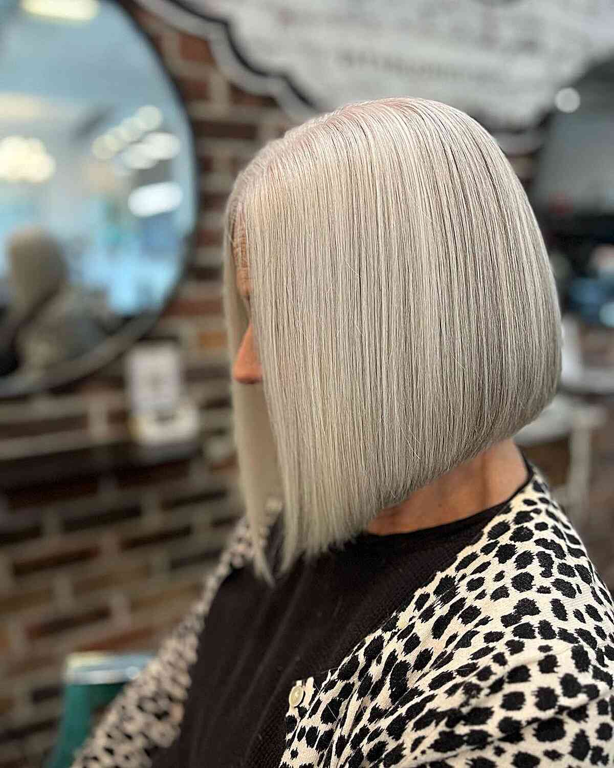 Angled Bob with Light Grey Balayage for older women with short straight hair