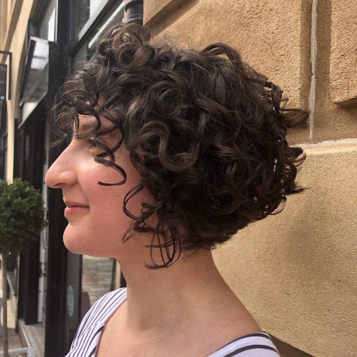 Angled curly bob with bangs