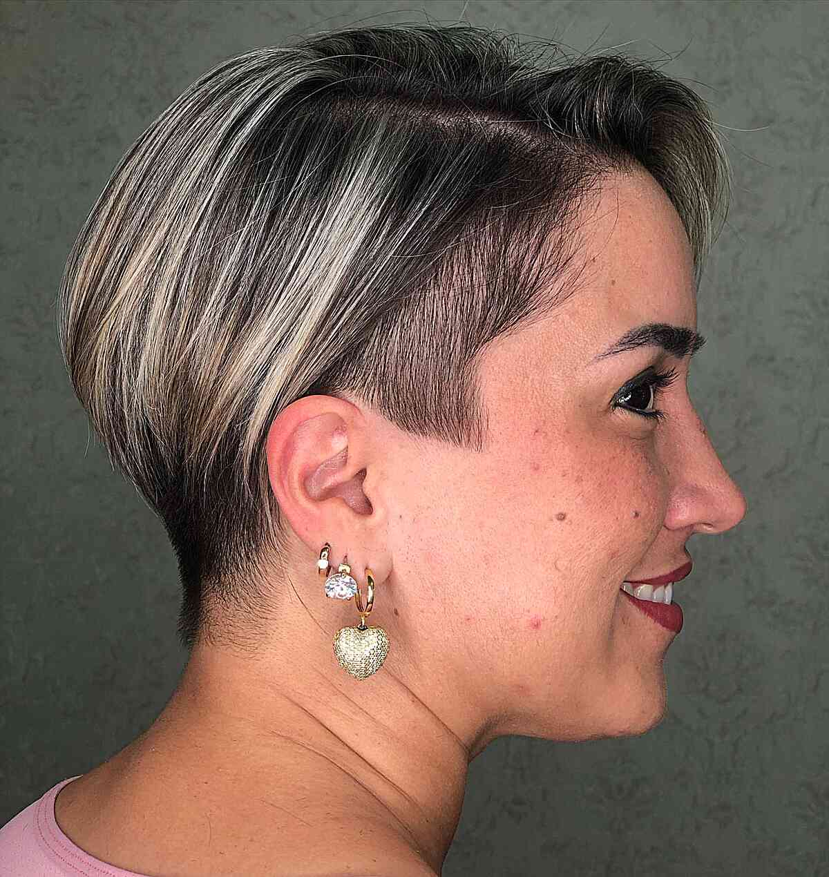 Angled Long Pixie Undercut with Blonde Highlights for Older Ladies