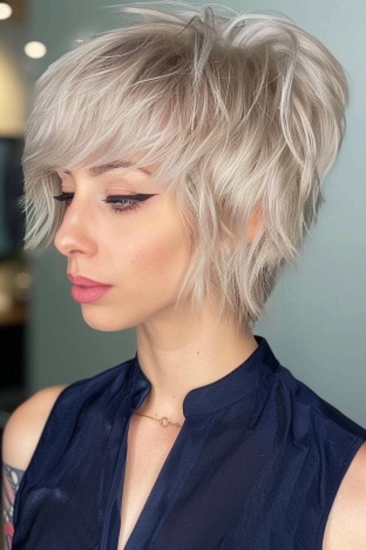 The woman created a lively and voluminous hairstyle with an angled pixie cut accentuated by dynamic layers.