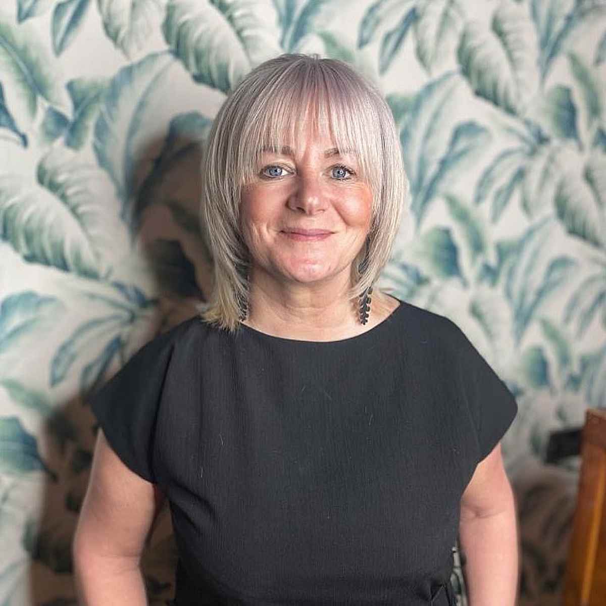 Ash Blonde Lob with Face-Framing Layers and Bangs for Women Over Fifty