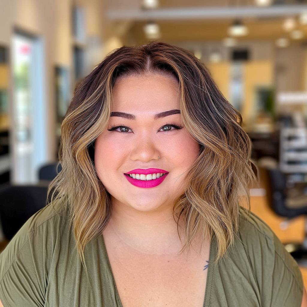 Mid-length Asian layered haircut designed to slim round face shapes