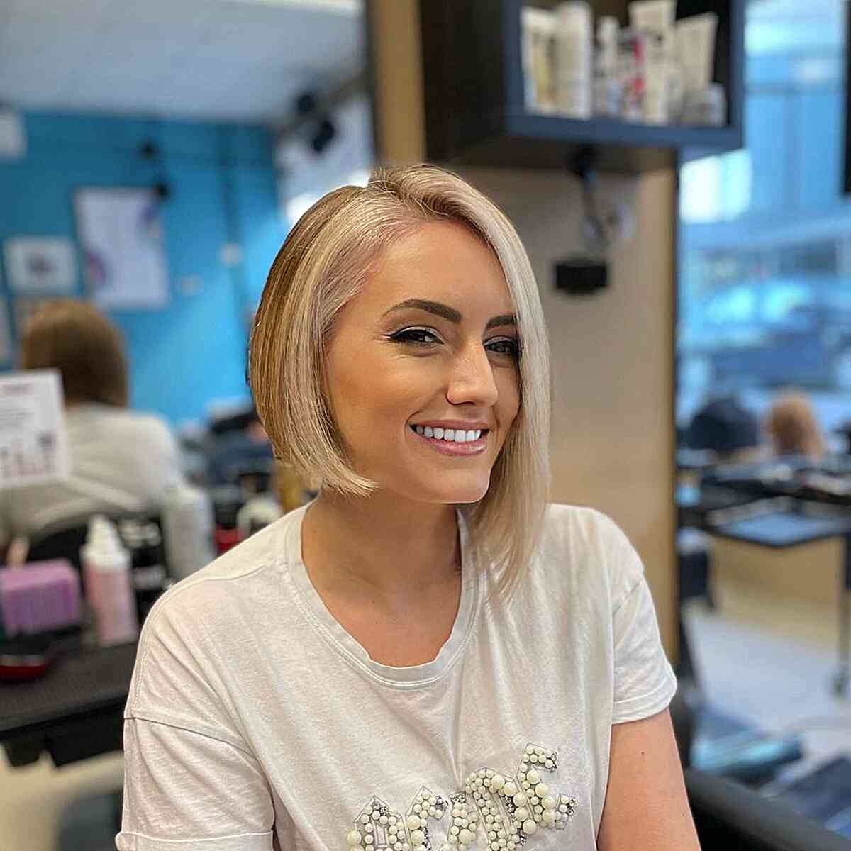Asymmetrical Face-Framing Cut with a side part going from the chin on one side to the shoulder on the other for fine hair