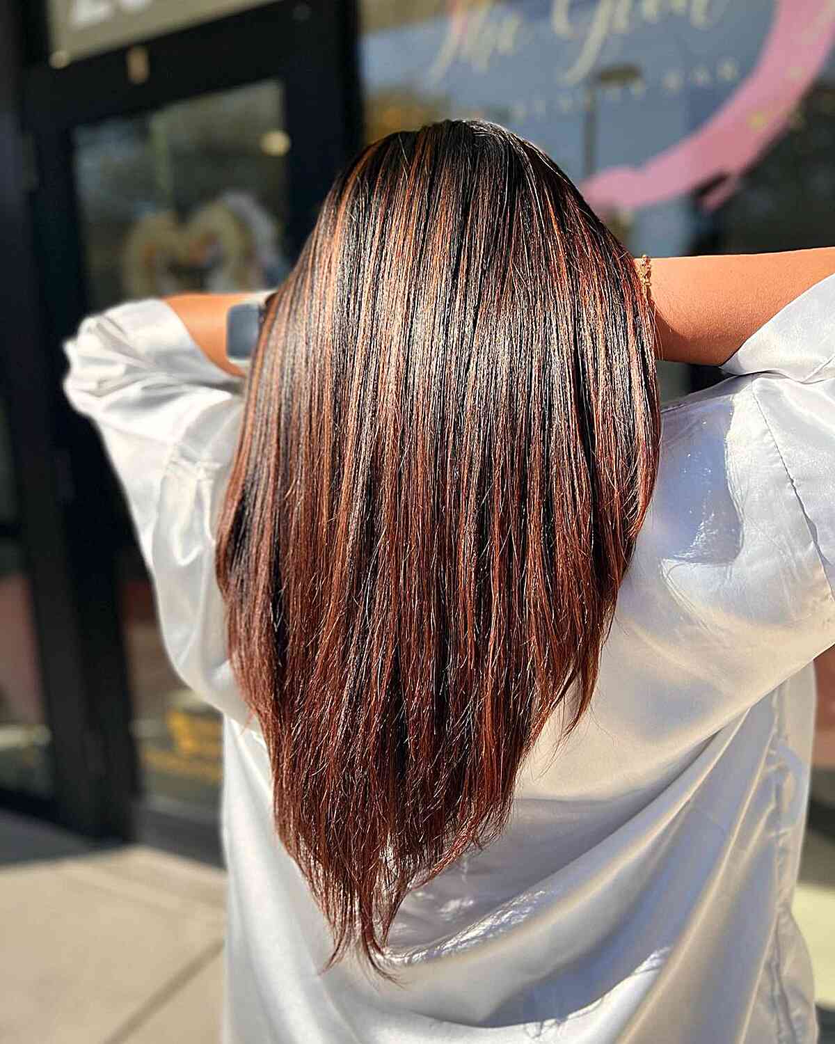 Long Auburn V-Shaped Cut with Straight Layers and Dark Roots