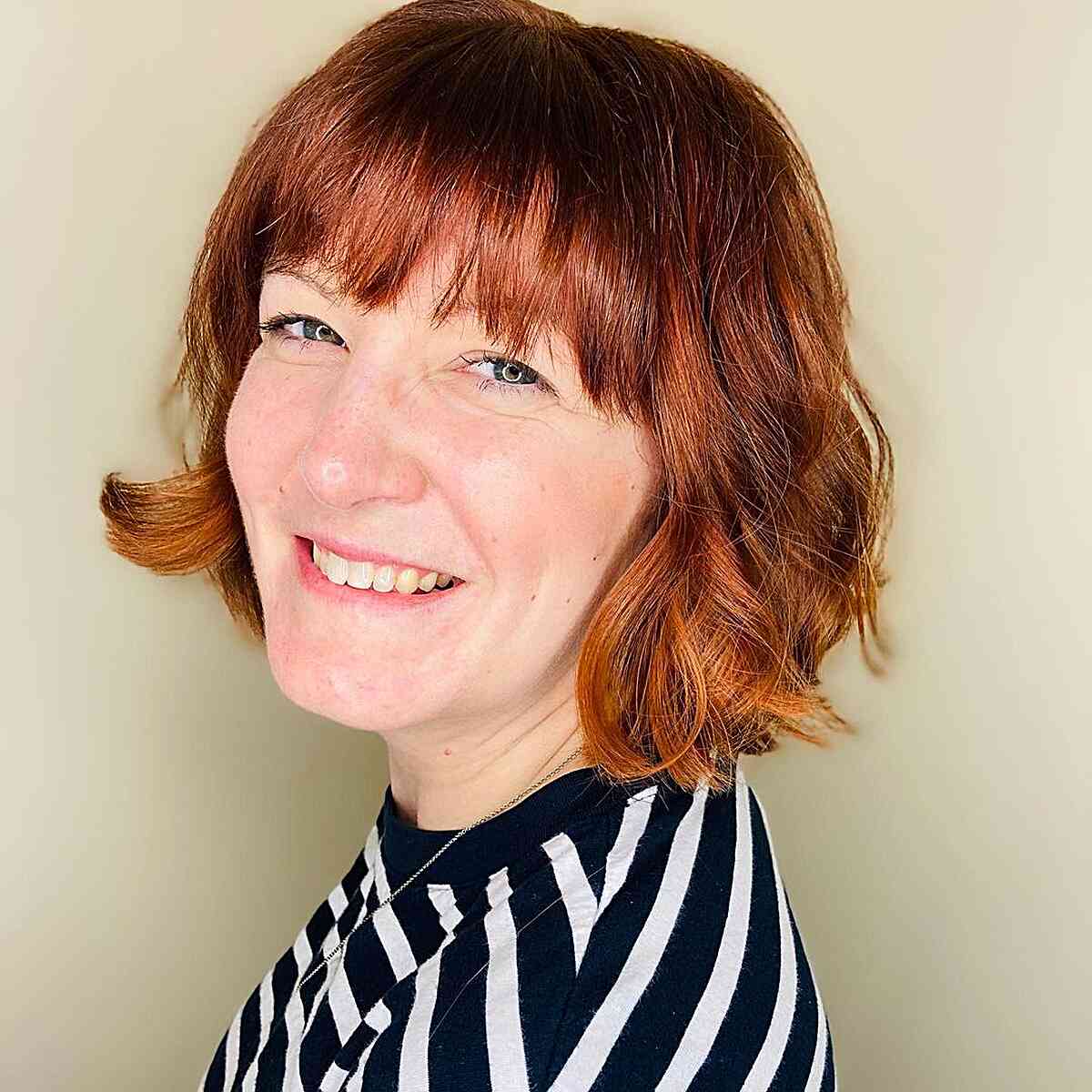 Autumn-Style Burgundy Ginger Bob with Bangs for 40-year-olds