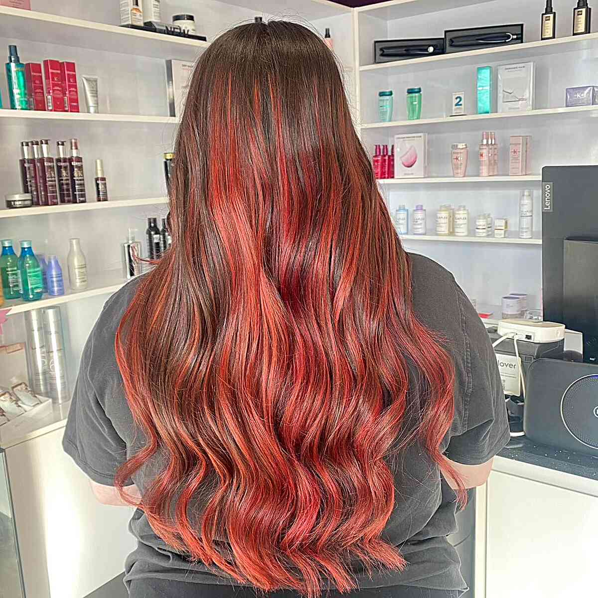 Long Wavy Balayage Hair with Vivid Strawberry Red and Brown Roots