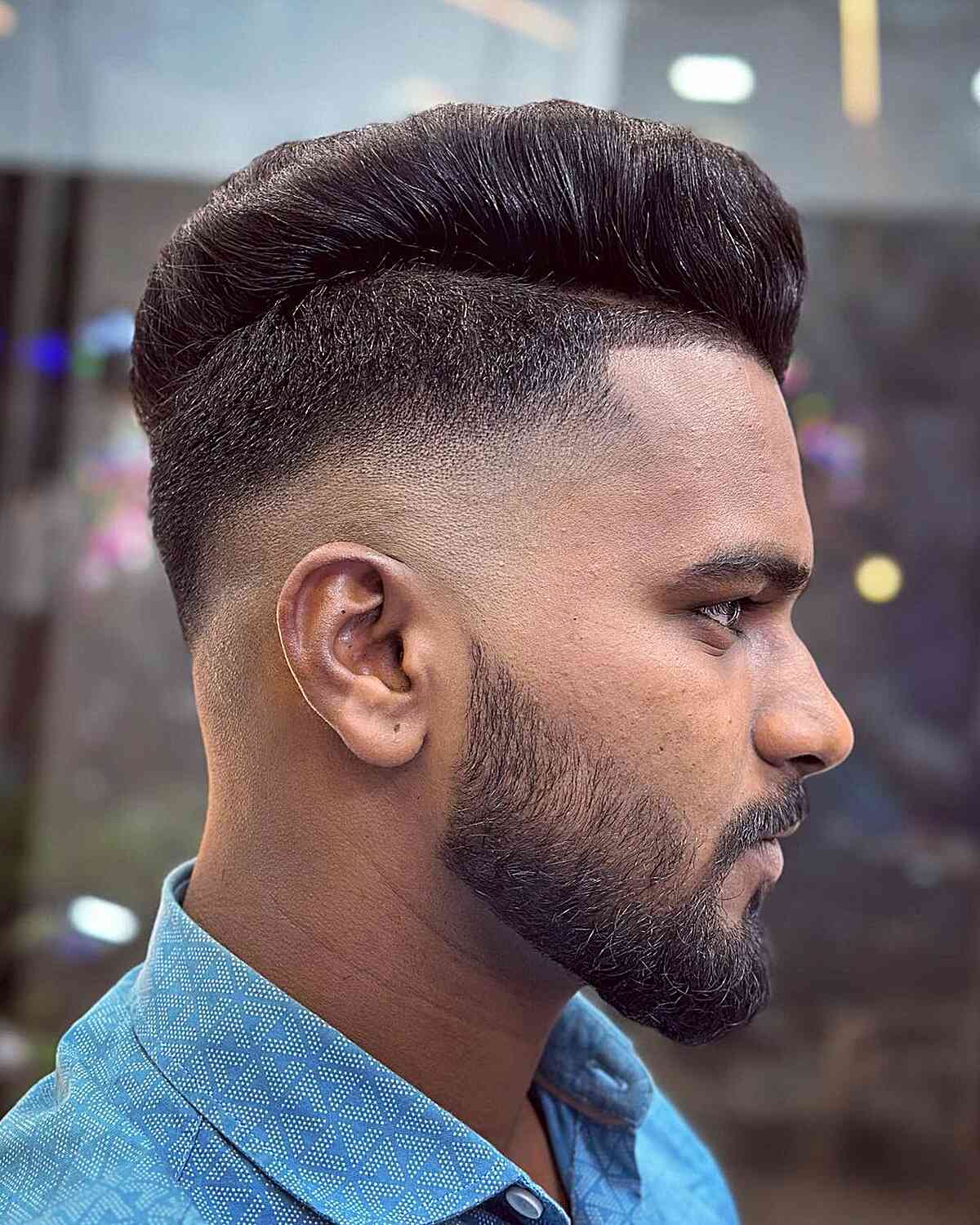 Bald Fade with a Disconnected Top for Men with a beard and handsome style