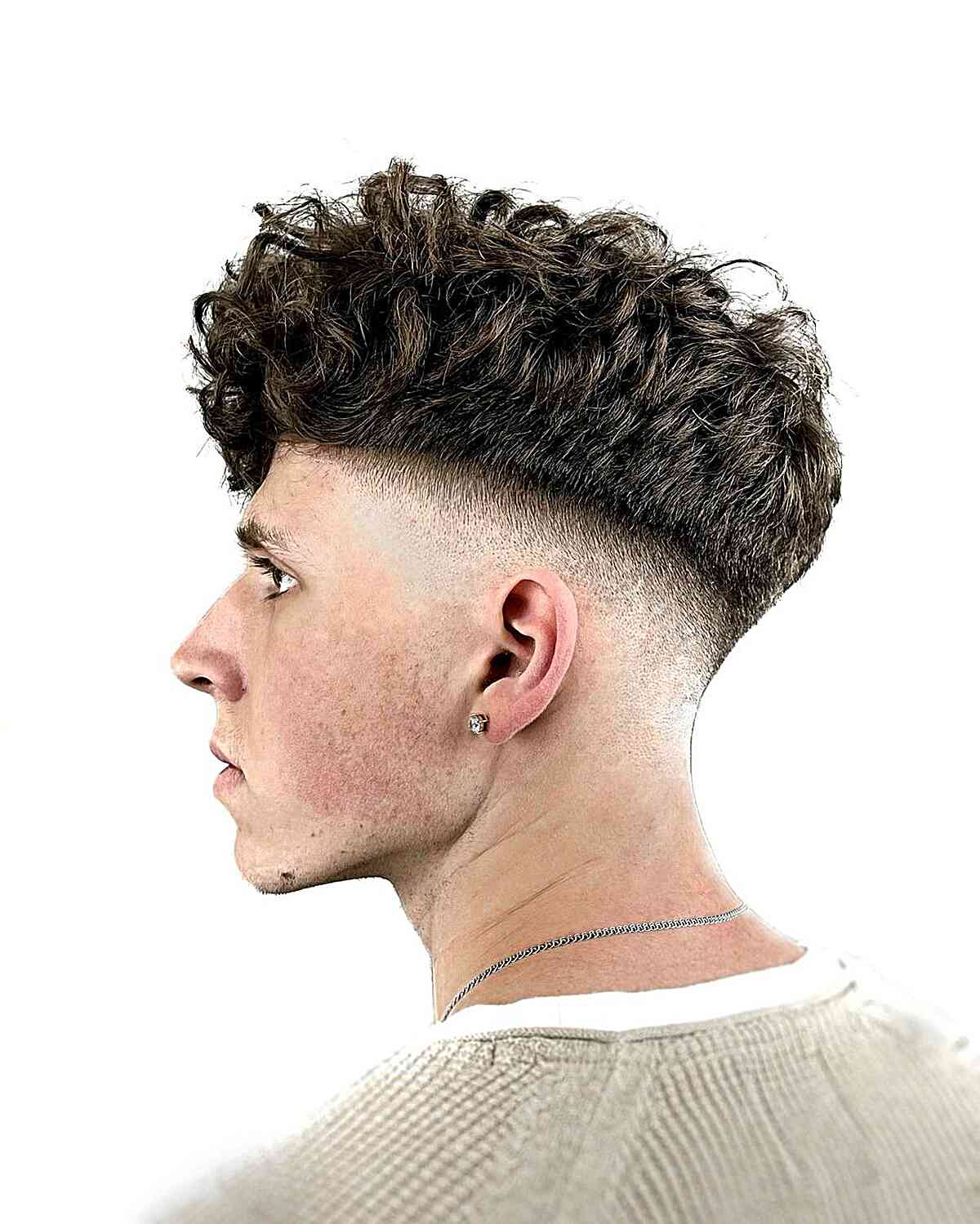 Bald Fade with Volume on Top for Guys with curly hair