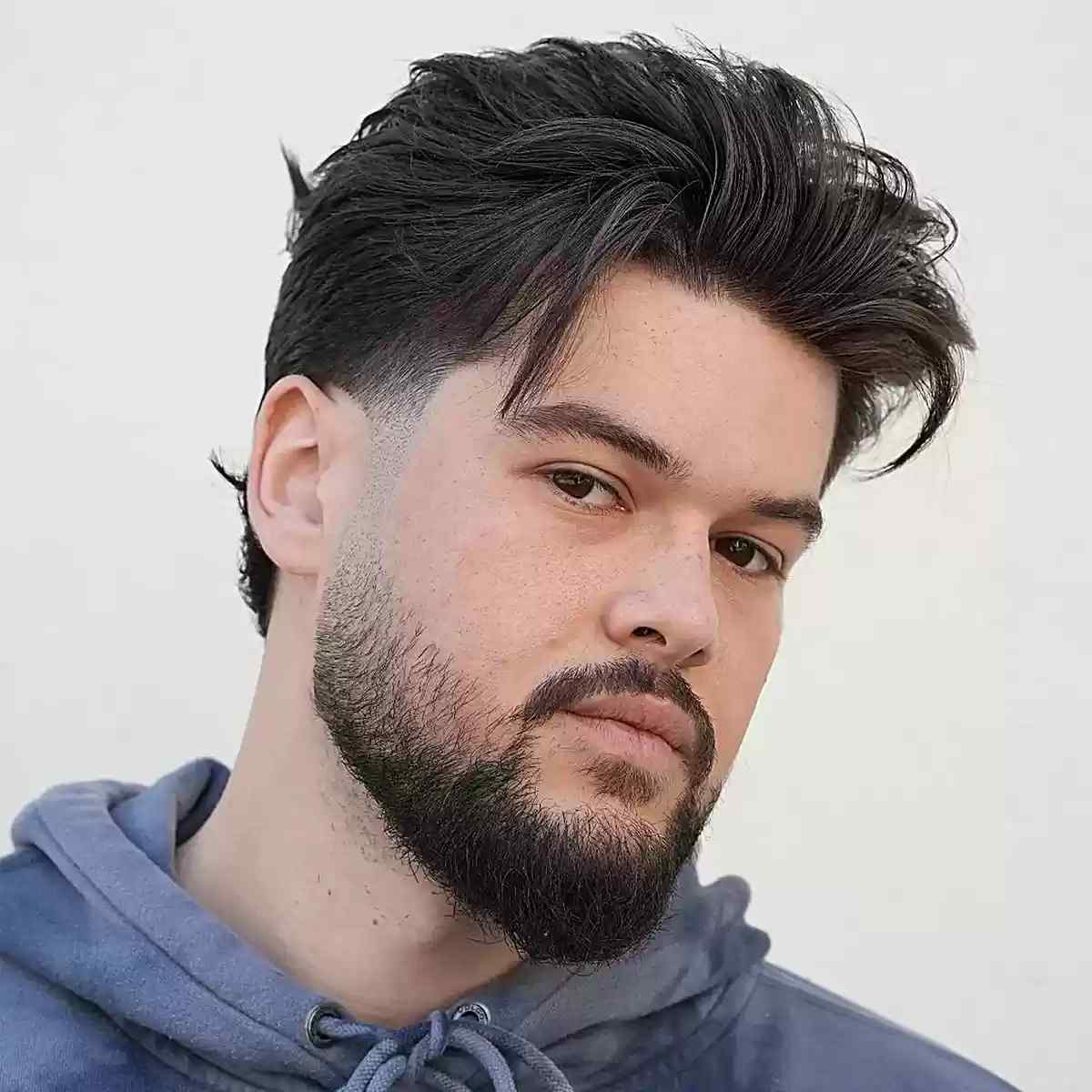 Beard Fade with a Mid-Length Messy Cut for Men with Thick Hair