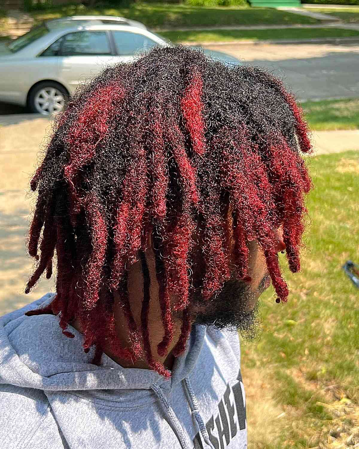 Black Freeform Locs with Red Highlights on Men with Kinky Hair