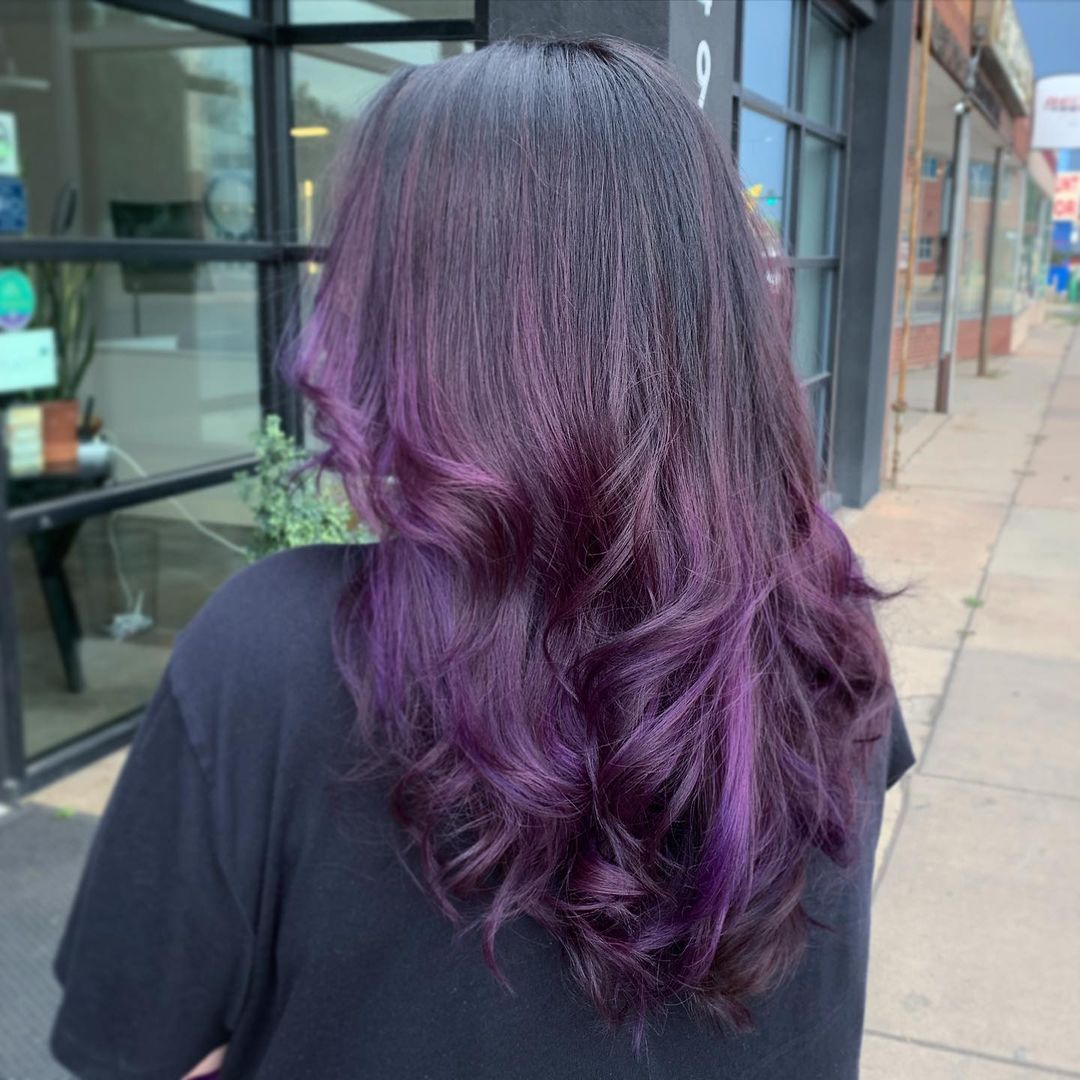 Black Hair with Vibrant Purple Highlights