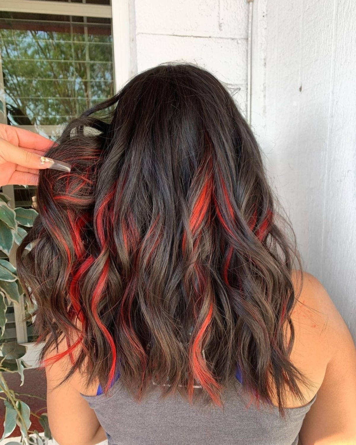 Black hair with red highlights underneath
