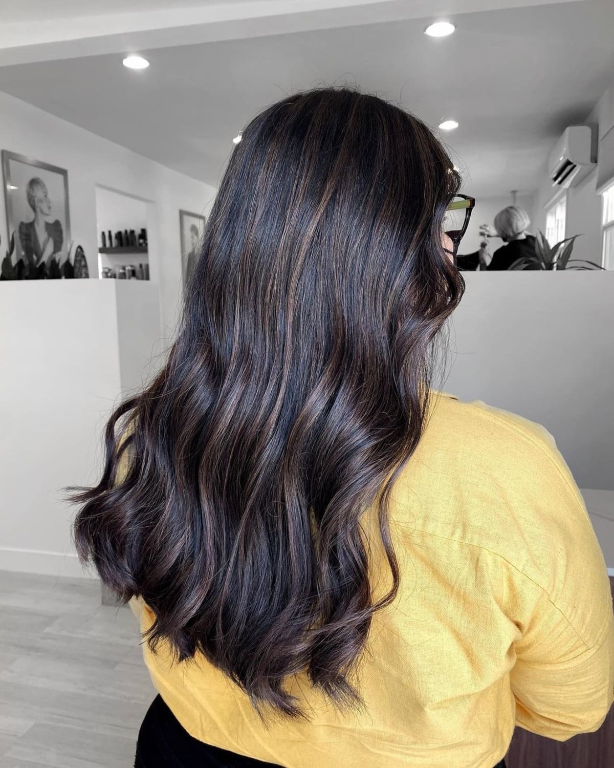 Low-maintenance black hair with subtle highlights