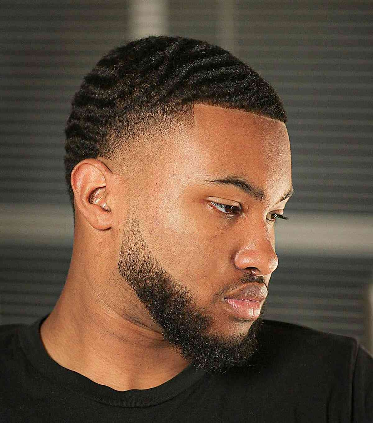Black men's finger waves with a beard for guys with a sharp image