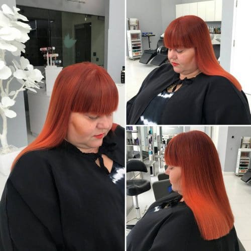 Blazing red copper hair color with bangs