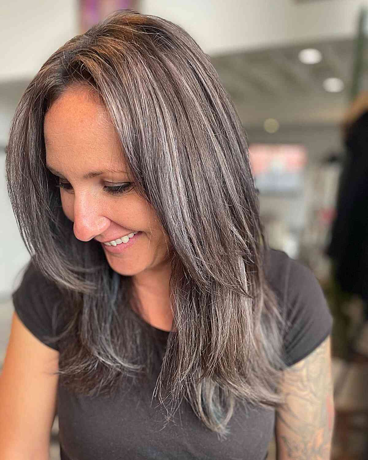 Blended Grayish Silver on Chest-Length Layered Dark Hair