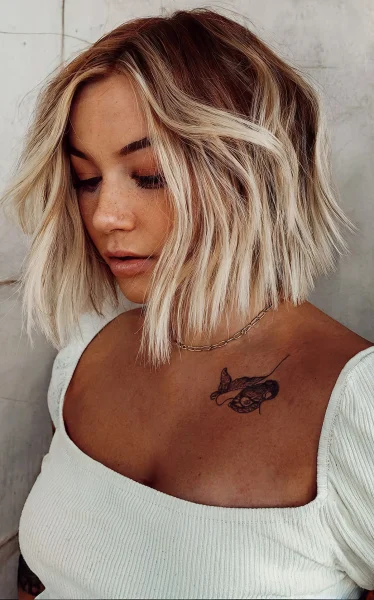 A Blonde Blunt Cut with Dark Roots