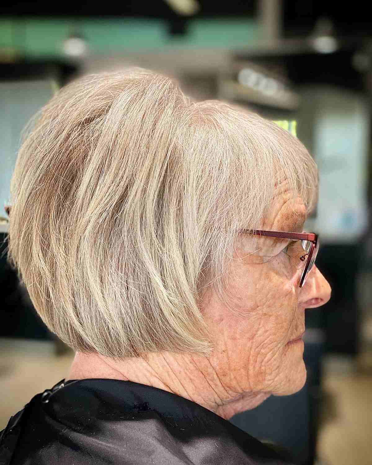 Blonde Bob with Bangs and Teased Crown for an Older Woman