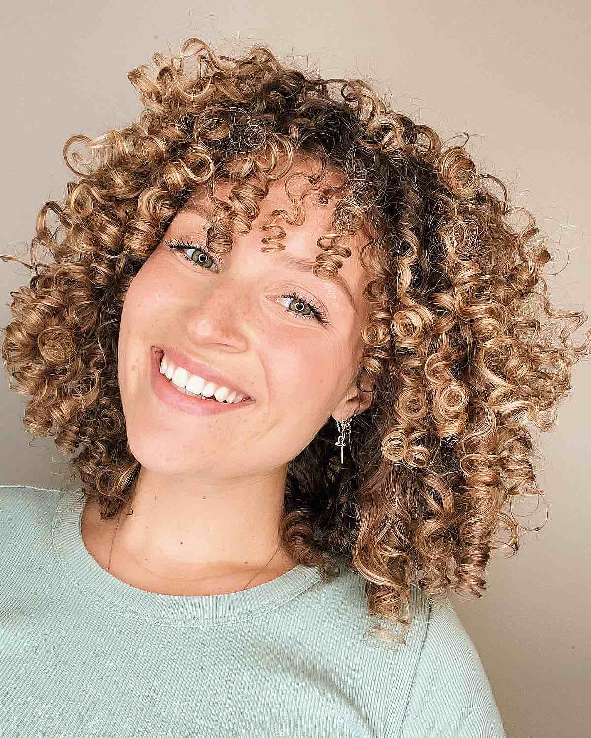 blonde curly bob with ringlets and bangs