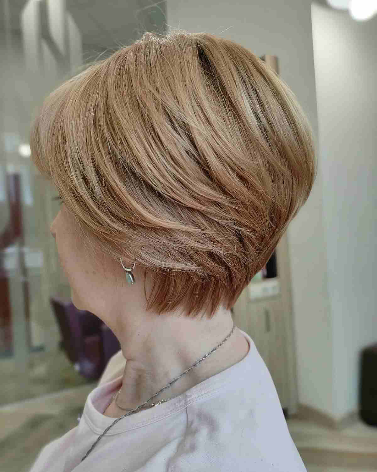 Blonde Feathered Bob for 50-Year-Olds with Thick Hair