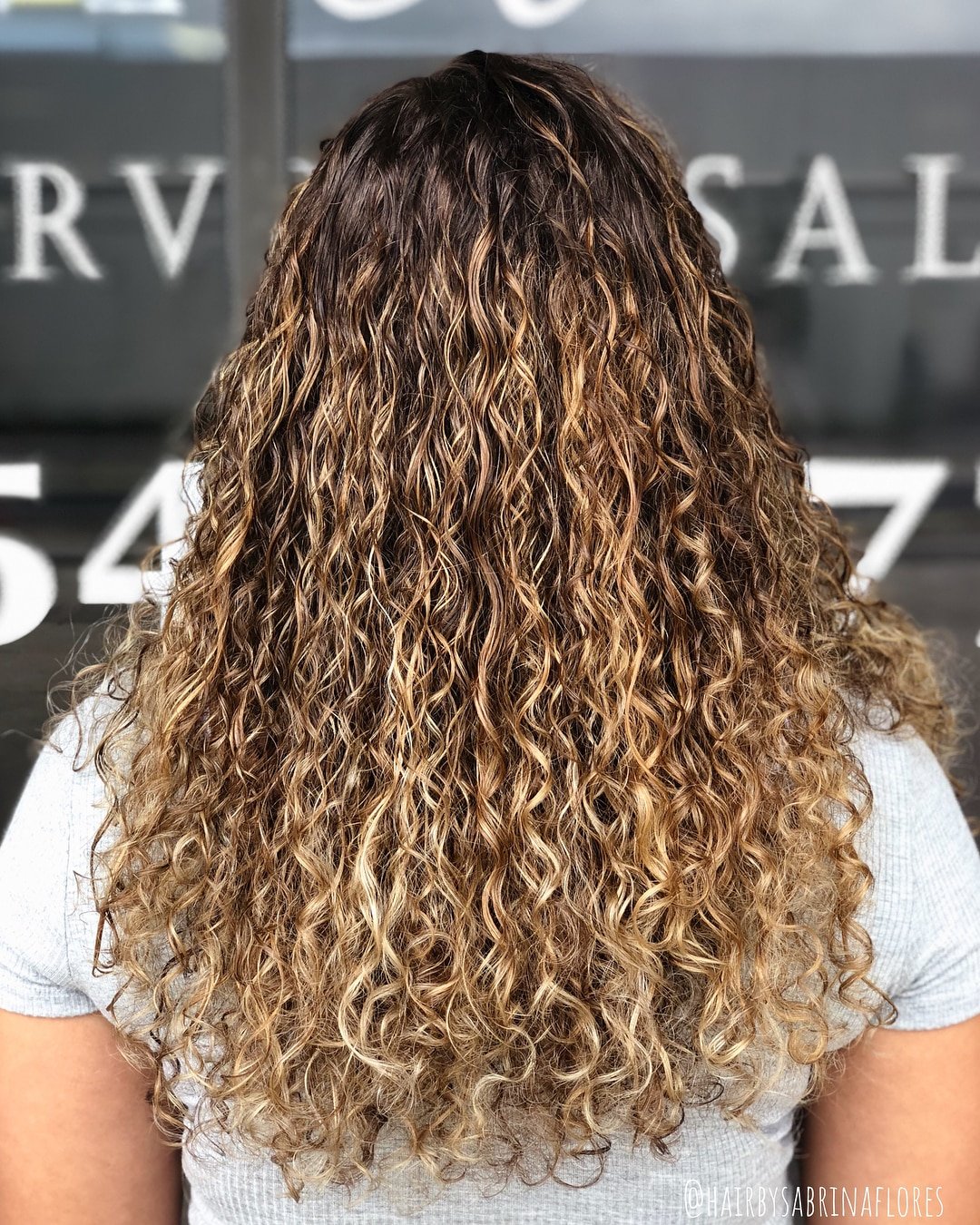 Versatile Sandy Blonde Balayage for Naturally Curly Hair