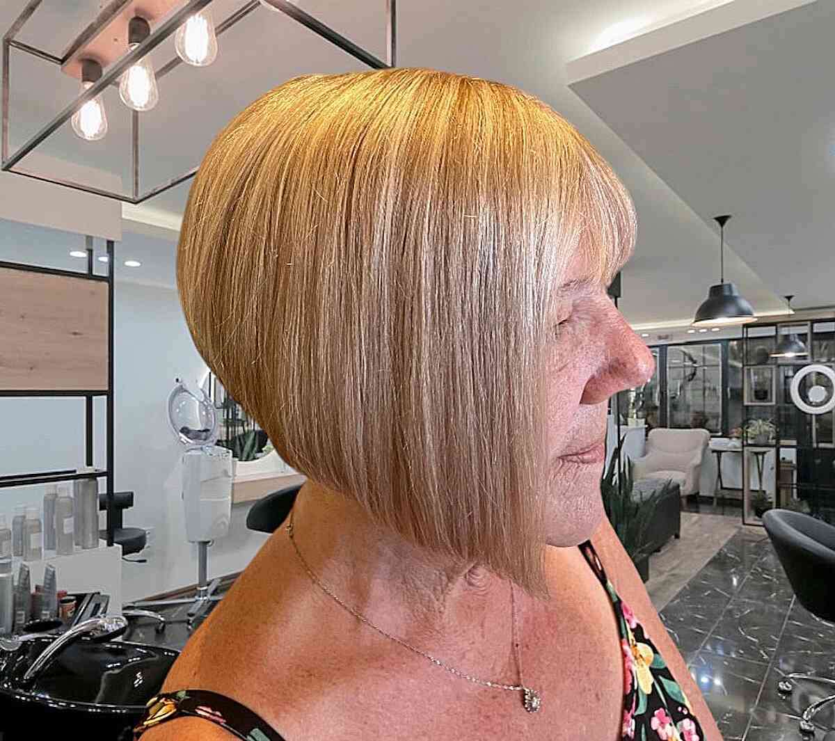 Chin-Length Blonde Graduated Wedge Bob with Thin Bangs for Older Women