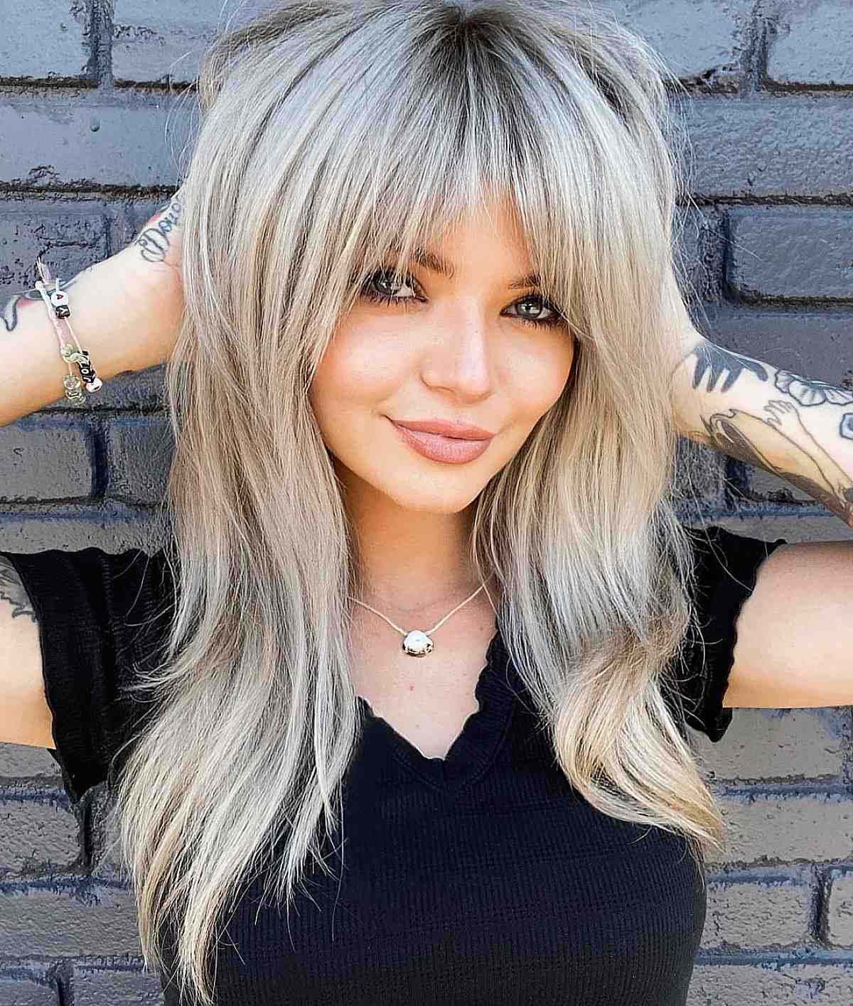 blonde long hair with bangs hairstyle