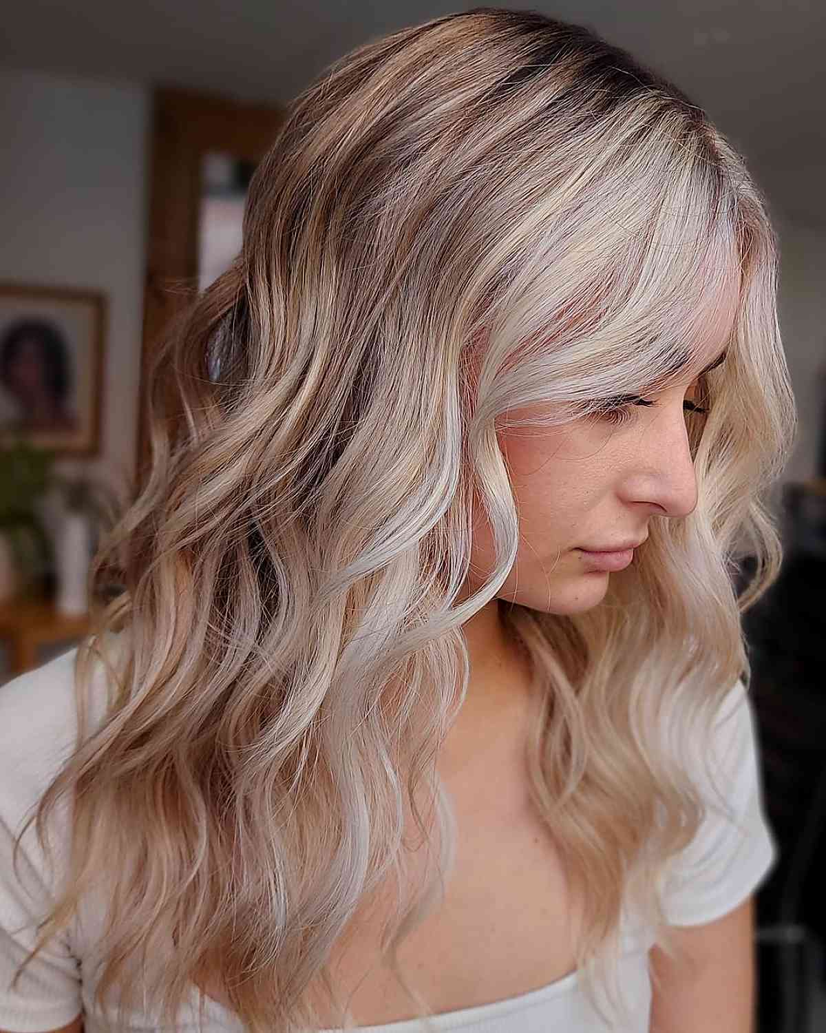blonde loose beach waves with dark roots