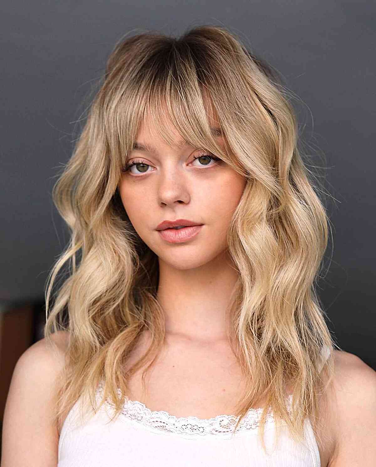 Blonde Medium-Length Waves with Fringe for an Oval Face 