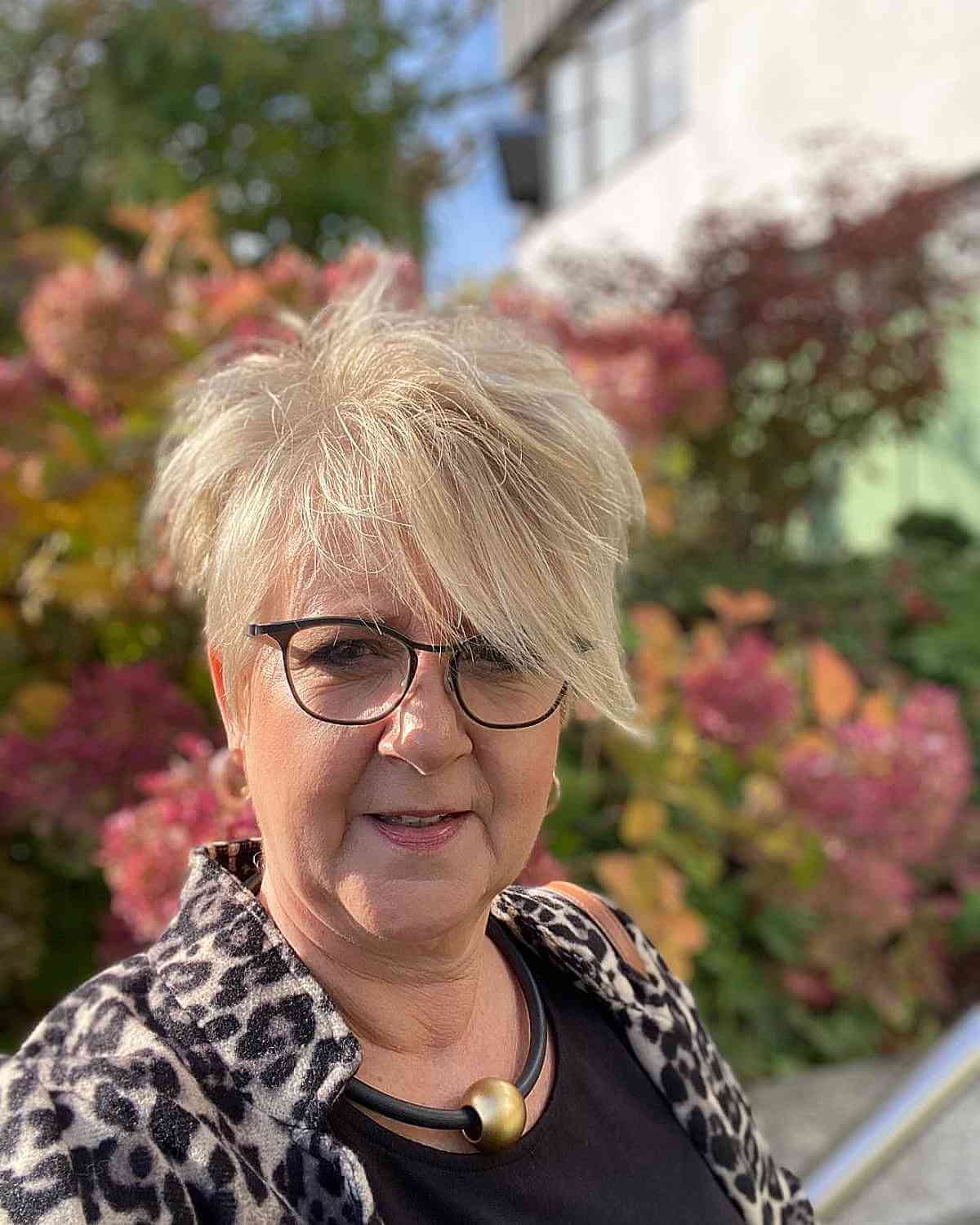 Blonde Pixie with Extra Long Bangs for 60-Year-Olds with Glasses